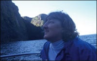 Helen looks up at the cliffs of Mingulay, 2004